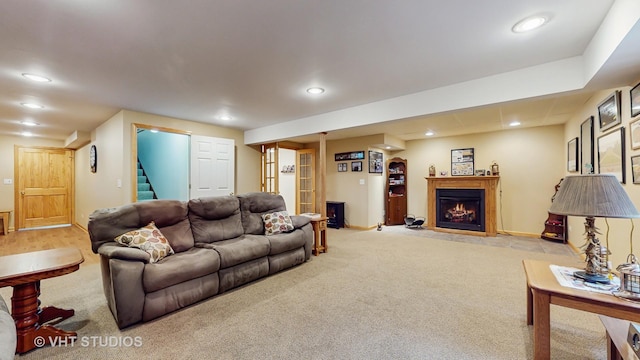 2217 Tyler Trl, Mchenry, IL 60051 - carpeted living area with stairway, recessed lighting, baseboards, and a fireplace with flush hearth
