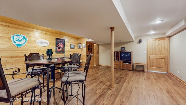 2217 Tyler Trl, Mchenry, IL 60051 - dining space with wooden walls, light wood-style floors, and baseboards