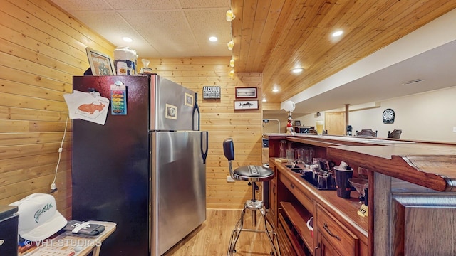 2217 Tyler Trl, Mchenry, IL 60051 - kitchen with freestanding refrigerator, wooden walls, light wood-style flooring, wood ceiling, and recessed lighting