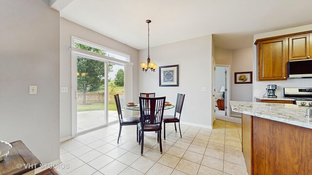2217 Tyler Trl, Mchenry, IL 60051 - dining room featuring a chandelier, baseboards, and light tile patterned flooring