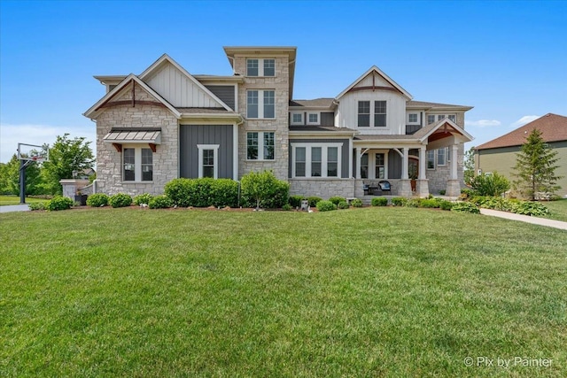 1044 Redbud Ln, Sugar Grove, IL 60554 - craftsman-style house with board and batten siding, stone siding, a front lawn, and a porch