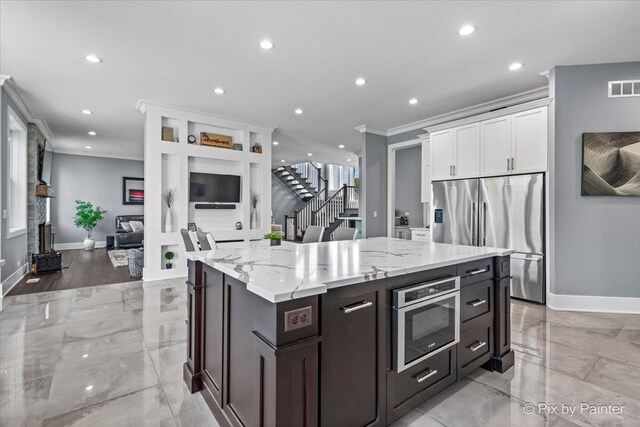 1044 Redbud Ln, Sugar Grove, IL 60554 - kitchen with stainless steel fridge with ice dispenser, ornamental molding, white cabinets, recessed lighting, and light stone countertops