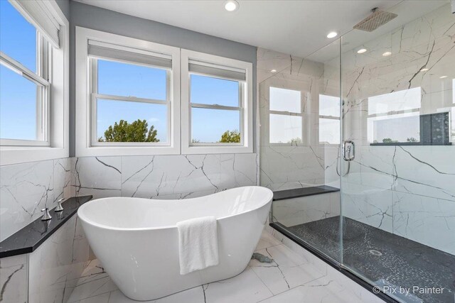 1044 Redbud Ln, Sugar Grove, IL 60554 - full bathroom featuring tile walls, marble tiled flooring, a marble finish shower, a freestanding tub, and recessed lighting