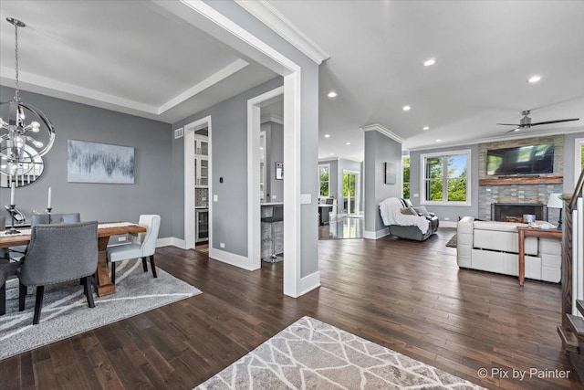 1044 Redbud Ln, Sugar Grove, IL 60554 - dining area with a stone fireplace, a chandelier, ceiling fan, recessed lighting, and wood finished floors