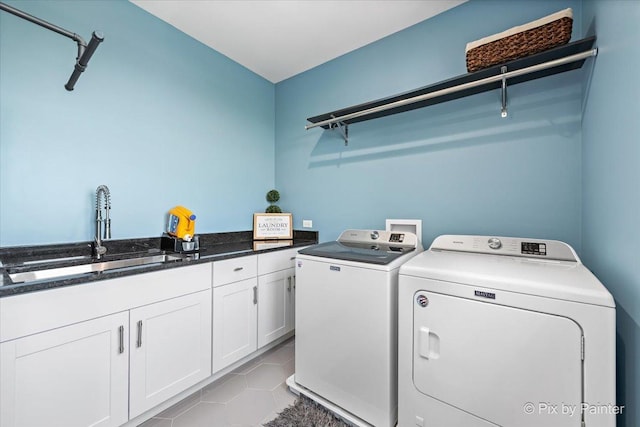 1044 Redbud Ln, Sugar Grove, IL 60554 - laundry area featuring separate washer and dryer, cabinet space, and light tile patterned floors