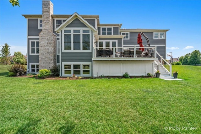 1044 Redbud Ln, Sugar Grove, IL 60554 - back of house with stairs, a yard, a chimney, and board and batten siding