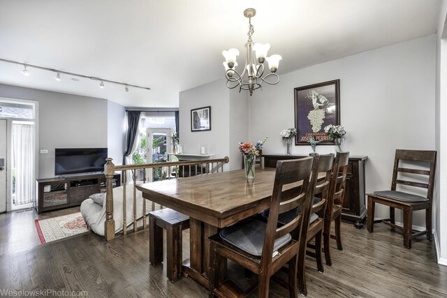 3315 N Racine Ave Unit E, Chicago, IL 60657 - dining room featuring wood finished floors, track lighting, and a chandelier