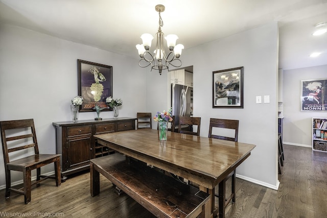 3315 N Racine Ave Unit E, Chicago, IL 60657 - dining space featuring a chandelier and dark wood-style floors