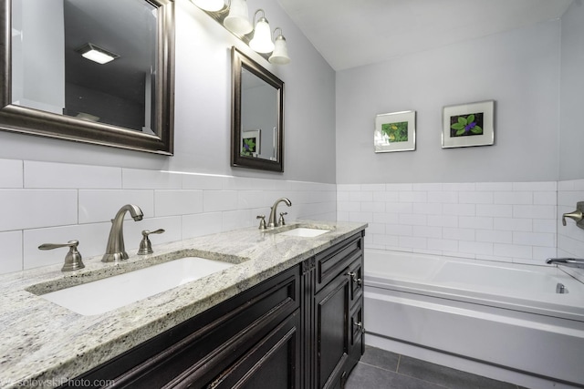 3315 N Racine Ave Unit E, Chicago, IL 60657 - bathroom with double vanity, a garden tub, and tile patterned floors