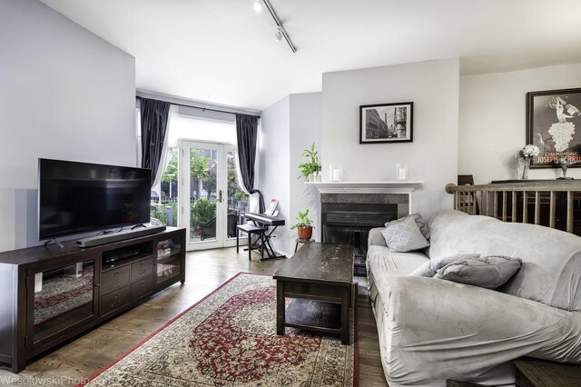 3315 N Racine Ave Unit E, Chicago, IL 60657 - living room with track lighting, wood finished floors, and a fireplace