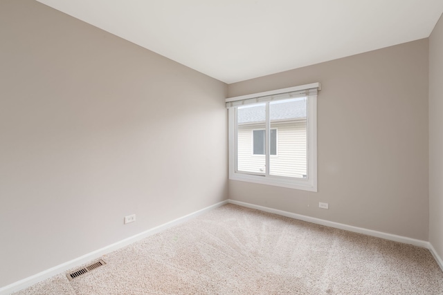 1355 Kingsbury Dr Unit 1, Hanover Park, IL 60133 - unfurnished room featuring baseboards and carpet floors