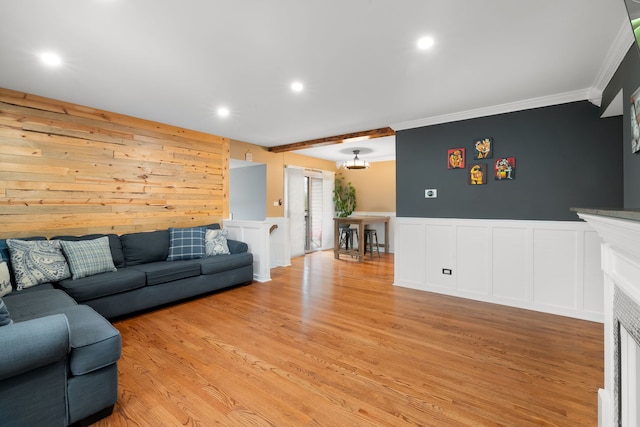 1355 Kingsbury Dr Unit 1, Hanover Park, IL 60133 - living room featuring crown molding, a decorative wall, light wood-style floors, recessed lighting, and a wainscoted wall