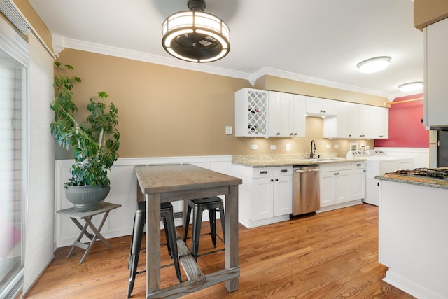 1355 Kingsbury Dr Unit 1, Hanover Park, IL 60133 - kitchen with separate washer and dryer, ornamental molding, white cabinetry, stainless steel dishwasher, and a sink
