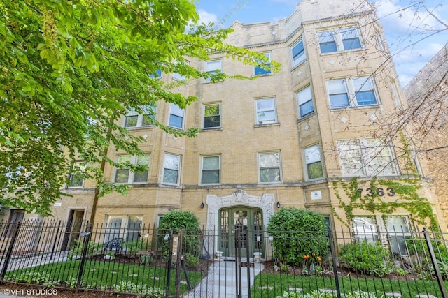 7363 N Damen Ave Unit 302, Chicago, IL 60645 - view of apartment building / complex with a fenced front yard