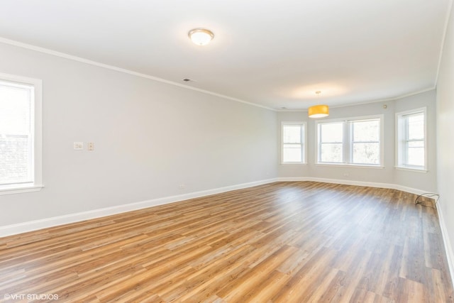 7363 N Damen Ave Unit 302, Chicago, IL 60645 - spare room with ornamental molding, light wood-type flooring, and baseboards