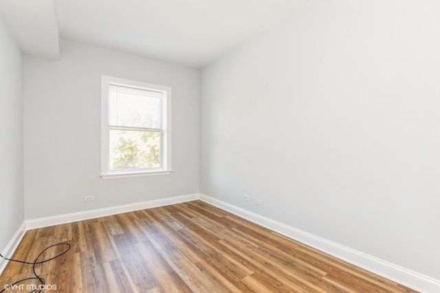 7363 N Damen Ave Unit 302, Chicago, IL 60645 - spare room featuring baseboards and wood finished floors