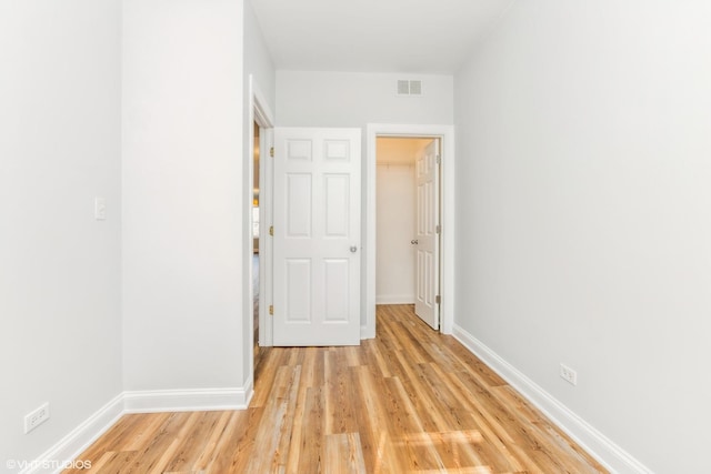 7363 N Damen Ave Unit 302, Chicago, IL 60645 - unfurnished room featuring light wood-style floors and baseboards