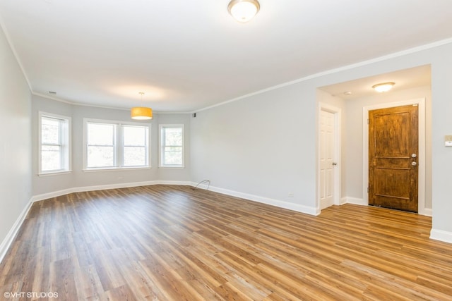 7363 N Damen Ave Unit 302, Chicago, IL 60645 - unfurnished room with ornamental molding, light wood-style flooring, and baseboards