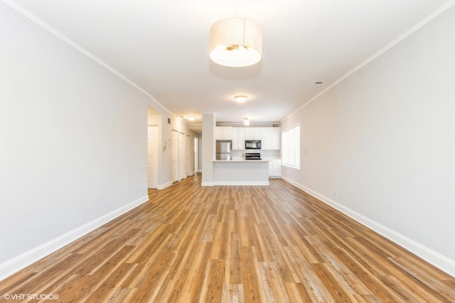 7363 N Damen Ave Unit 302, Chicago, IL 60645 - unfurnished living room featuring crown molding, light wood-style flooring, and baseboards