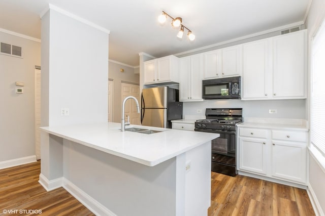7363 N Damen Ave Unit 302, Chicago, IL 60645 - kitchen with black appliances, a sink, light wood-type flooring, white cabinetry, and ornamental molding