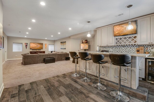 785 N Emroy Ave, Elmhurst, IL 60126 - kitchen with dark wood finished floors, tasteful backsplash, baseboards, recessed lighting, and a kitchen breakfast bar