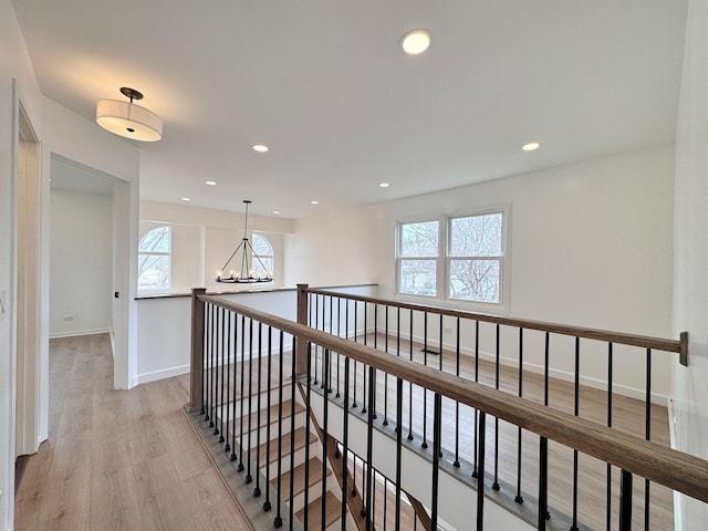 2326 Hamilton Pl Unit 2326, Schaumburg, IL 60194 - hallway with plenty of natural light, light wood-type flooring, a chandelier, baseboards, and recessed lighting