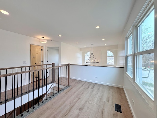 2326 Hamilton Pl Unit 2326, Schaumburg, IL 60194 - empty room featuring light wood-type flooring, a chandelier, baseboards, and recessed lighting