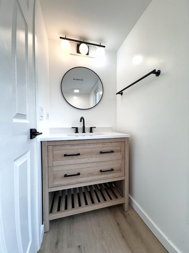 2326 Hamilton Pl Unit 2326, Schaumburg, IL 60194 - bathroom with vanity, wood finished floors, and baseboards