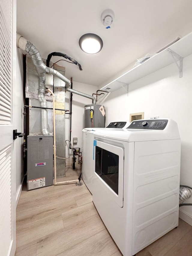 2326 Hamilton Pl Unit 2326, Schaumburg, IL 60194 - laundry room featuring water heater, washing machine and dryer, and light wood-style floors