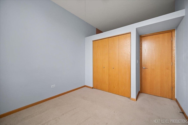 1673 Town Center St Unit 1673, Aurora, IL 60504 - unfurnished bedroom featuring carpet, baseboards, a closet, and vaulted ceiling