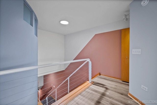 1673 Town Center St Unit 1673, Aurora, IL 60504 - hall featuring baseboards, wood finished floors, and an upstairs landing