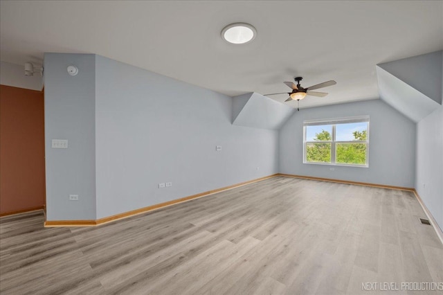 1673 Town Center St Unit 1673, Aurora, IL 60504 - additional living space with ceiling fan, light wood-type flooring, baseboards, and lofted ceiling