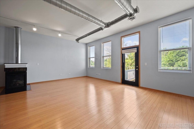 1673 Town Center St Unit 1673, Aurora, IL 60504 - unfurnished living room featuring light wood-style flooring and rail lighting