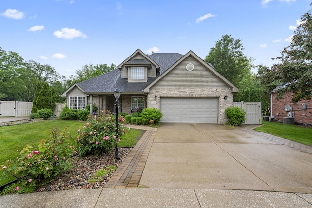5225 Nicholas Ct, Oak Forest, IL 60452 - traditional-style home featuring a gate, brick siding, a garage, and concrete driveway