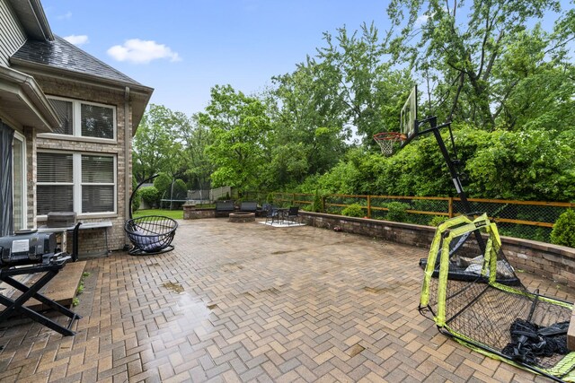 5225 Nicholas Ct, Oak Forest, IL 60452 - fenced backyard featuring an outdoor fire pit, a patio, and view of scattered trees
