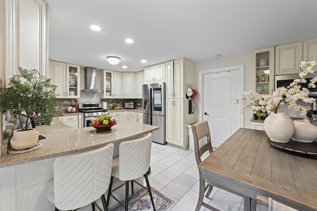 5225 Nicholas Ct, Oak Forest, IL 60452 - kitchen featuring stainless steel appliances, wall chimney range hood, recessed lighting, backsplash, and a peninsula