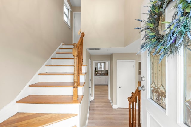 4520 Prince St, Downers Grove, IL 60515 - foyer entrance with a towering ceiling, wood finished floors, stairs, and baseboards