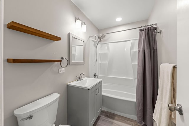 4520 Prince St, Downers Grove, IL 60515 - full bathroom with vanity, toilet, shower / bathtub combination with curtain, wood finished floors, and recessed lighting