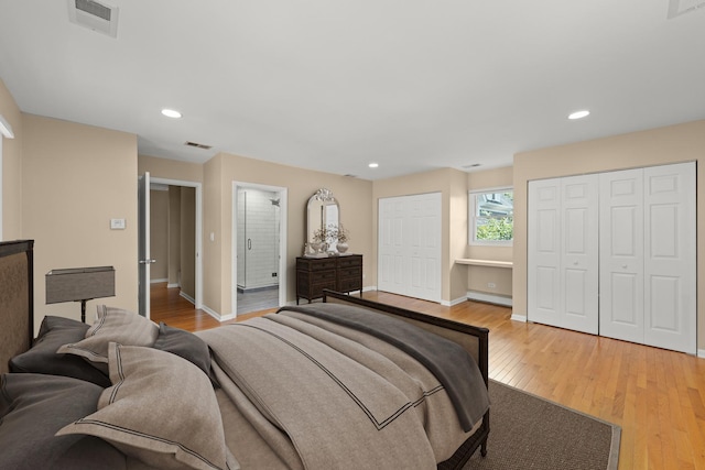 4520 Prince St, Downers Grove, IL 60515 - bedroom featuring multiple closets, light wood-style floors, baseboards, recessed lighting, and baseboard heating