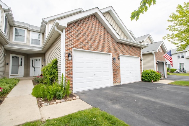 218 Partridge Ct, Algonquin, IL 60102 - view of front facade with brick siding, asphalt driveway, and a garage