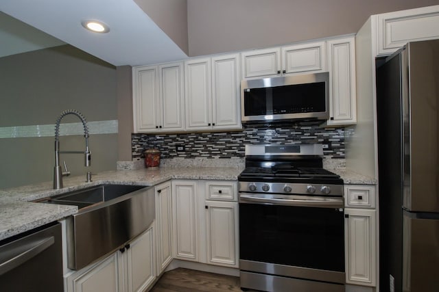 218 Partridge Ct, Algonquin, IL 60102 - kitchen featuring stainless steel appliances, decorative backsplash, light stone counters, recessed lighting, and white cabinetry