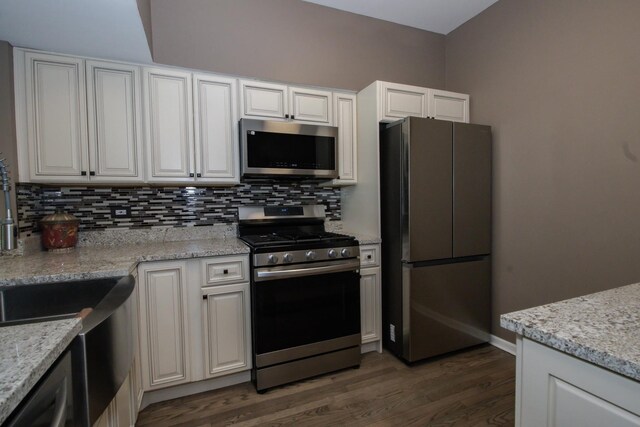218 Partridge Ct, Algonquin, IL 60102 - kitchen with stainless steel appliances, decorative backsplash, dark wood finished floors, white cabinets, and light stone countertops