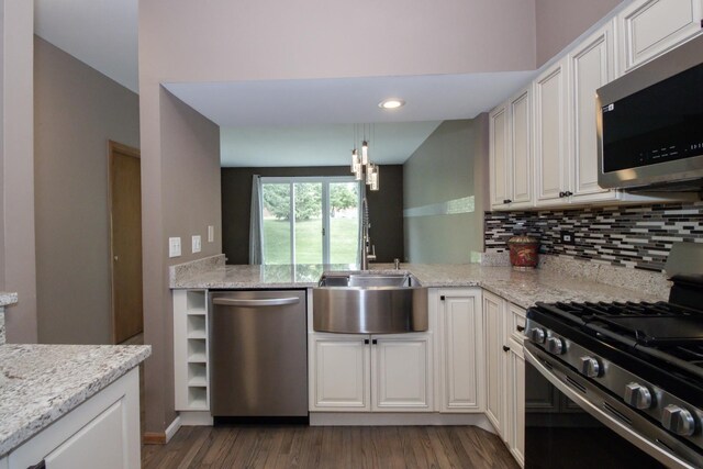218 Partridge Ct, Algonquin, IL 60102 - kitchen featuring appliances with stainless steel finishes, dark wood-style floors, tasteful backsplash, white cabinets, and light stone countertops