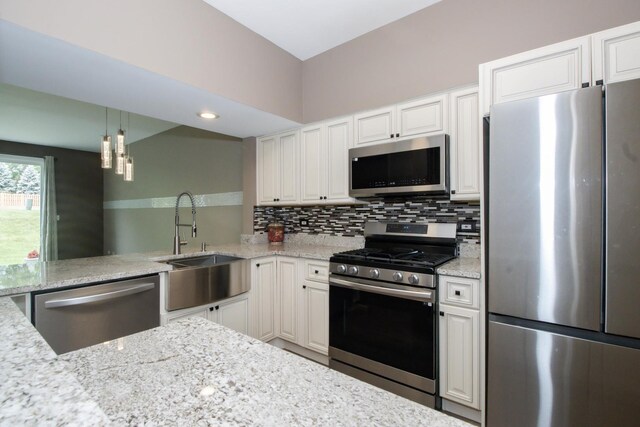 218 Partridge Ct, Algonquin, IL 60102 - kitchen featuring stainless steel appliances, decorative backsplash, light stone counters, and white cabinets