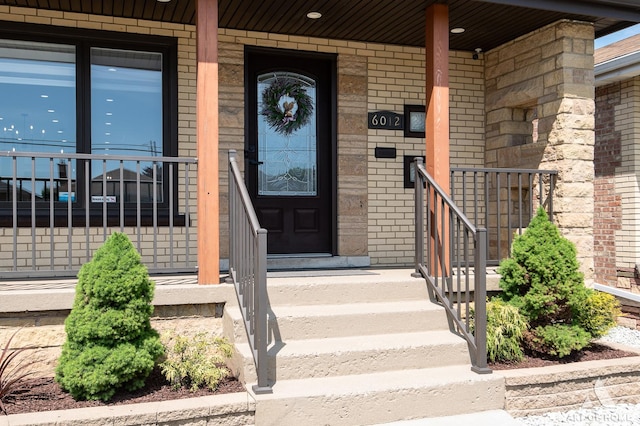 6012 S Narragansett Ave, Chicago, IL 60638 - doorway to property featuring brick siding and a porch