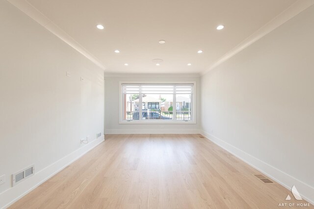 6012 S Narragansett Ave, Chicago, IL 60638 - empty room featuring crown molding, light wood-style flooring, recessed lighting, and baseboards