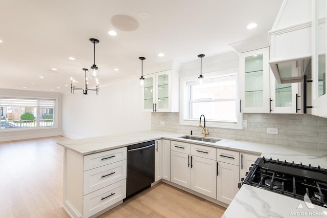 6012 S Narragansett Ave, Chicago, IL 60638 - kitchen featuring black appliances, a sink, a peninsula, white cabinetry, and tasteful backsplash