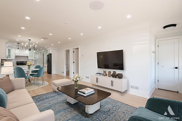 6012 S Narragansett Ave, Chicago, IL 60638 - living area featuring recessed lighting, light wood finished floors, baseboards, and a chandelier