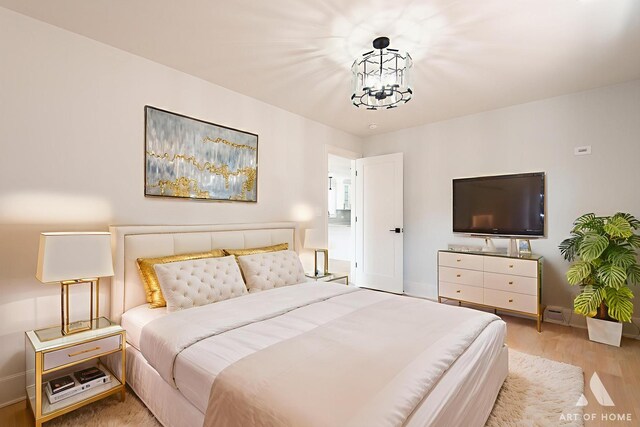 6012 S Narragansett Ave, Chicago, IL 60638 - bedroom with wood finished floors, a chandelier, and baseboards
