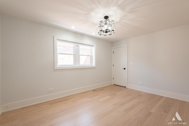 6012 S Narragansett Ave, Chicago, IL 60638 - unfurnished room featuring light wood-type flooring, baseboards, recessed lighting, and a chandelier